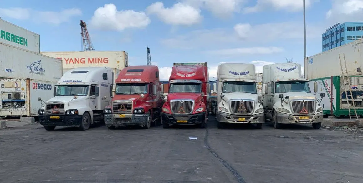 Hoàng Khang's fleet of container trucks at a Hải Phòng container yard
